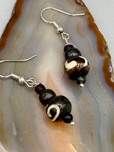 Load image into Gallery viewer, Mismatched round bone beads create an adaptable look when paired with neutral colors and wavy patterns, enabling wearers to tailor their ensembles in whatever way they desire. Measurements: 1 1/2 ” in length