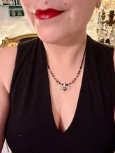 Load image into Gallery viewer, This beautiful Bee Pendant With Black and Yellow Beaded Necklace is the perfect accessory for any summer outfit. The vibrant colors will make a bold statement, while the black and gold blend adds a subtle elegance. Its perfect for any nature lover, hippie, or witchy style. Measurements: Necklace is 18”