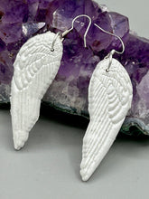 Load image into Gallery viewer, Shimmery white polymer clay earrings in the shape of angel wings are perfect for a subtle yet elegant look.