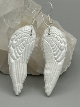 Load image into Gallery viewer, Shimmery white polymer clay earrings in the shape of angel wings are perfect for a subtle yet elegant look.