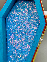 Load image into Gallery viewer, Coffin shaped box features a Day of the Dead kitty cat wearing a cute witchy hat while standing next to her witchy broom and her flying bat friend. The inside of the coffin is adorned with a witchy crescent moon, Jack-O-Lantern and a cute bat. This captivating coffin box makes an eye-catching, bewitching and whimsical Halloween-themed art piece that adds a one-of-a-kind Halloween touch to any home or office.