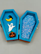 Load image into Gallery viewer, Coffin shaped box features a Day of the Dead kitty cat wearing a cute witchy hat while standing next to her witchy broom and her flying bat friend. The inside of the coffin is adorned with a witchy crescent moon, Jack-O-Lantern and a cute bat. This captivating coffin box makes an eye-catching, bewitching and whimsical Halloween-themed art piece that adds a one-of-a-kind Halloween touch to any home or office.