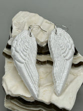Load image into Gallery viewer, Shimmery white polymer clay earrings in the shape of angel wings are perfect for a subtle yet elegant look.
