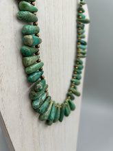 Load image into Gallery viewer, This striking Extra Large Turquoise Stone Beaded Necklace With Brass Finish Metal Beads instantly adds a touch of luxury to any outfit. Beautifully crafted with an alluring blend of extra large turquoise stone beads and brass finish metal beads, this distinctive necklace invokes an elegant cascade of vibrant color.    Measurements:    Necklace is 21 1/2 " in length adjustable to 23"