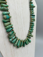 Load image into Gallery viewer, This striking Extra Large Turquoise Stone Beaded Necklace With Brass Finish Metal Beads instantly adds a touch of luxury to any outfit. Beautifully crafted with an alluring blend of extra large turquoise stone beads and brass finish metal beads, this distinctive necklace invokes an elegant cascade of vibrant color.    Measurements:    Necklace is 21 1/2 " in length adjustable to 23"