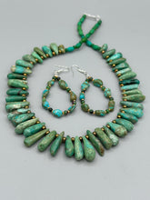 Load image into Gallery viewer, Our Blue-Green Magnesite Stone Beaded Hoop Earrings provide a nature-inspired look that is perfect for any boho-chic style. These earrings feature natural magnesite stone beads with small beads of turquoise and gold glass for subtle accent. Show off your bohemian look with these eye-catching hoops.  Measurements: 2 1/2" length