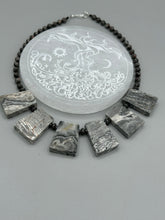 Load image into Gallery viewer, This rustic necklace features an eye-catching large trapezoid-shaped Picasso jasper and black agate combo set in a unique and chic design. Handcrafted from genuine stones, this necklace is perfect for any bohemian look. Measurements: Necklace is 19 1/2"