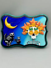 Load image into Gallery viewer, La Catrina y Gatita wall art is the purrfect hanging Day of the Dead art piece to add to your ofrenda. A tribute to an unbreakable bond and eternal love between cats and their guardians. Featuring a vibrant and intricate detail catrina and her floral crown accompanied by her beloved kitty cat. This Day of the Dead-inspired artwork adds a little touch of Mexican art to your home or office. A unique handcrafted gift for any cat lover. Measurements: H 5" x W 7” x D 1 1/2"