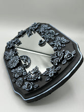 Load image into Gallery viewer, Make a bold statement with this handcrafted Goth Floral Decorative Mirror Wall Art Decor. The wood frame is complimented with highly detailed flowers, leaf and vine motifs, enhanced with shimmery metallic highlights for added texture and depth. Each intricate detail is carefully sculpted to create a unique and beautiful piece that's sure to make a statement. H 6 3/4" x W 9 1/2” x D 1"