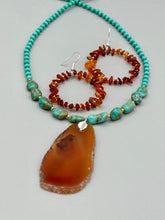 Load image into Gallery viewer, These hoop earrings feature natural amber stone chips and gold glass beads for an elegant, nature-inspired look. Measurements: 2" length and 2” in width