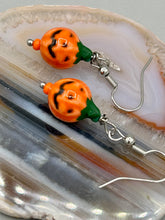 Load image into Gallery viewer, These super tiny and cute Peruvian Ceramic Jack-o-Lantern pumpkin halloween bead earrings are just perfect for fall and halloween. If halloween is not a season, rather a lifestyle, then these are perfect for every day outfits! Measurements: 7/8” in length, pumpkin beads 11mm