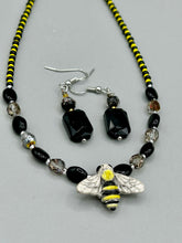 Load image into Gallery viewer, Elegantly crafted from black rectangular and circular glass beads, these dainty earrings offer a versatile style that can effortlessly elevate any ensemble.  Measurements: 1 3/8” in length