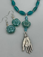 Load image into Gallery viewer, Upgrade your style with these sophisticated blue-green floral pressed glass earrings. Their iridescent glimmer finish adds a glamorous touch for any occasion. Crafted from lightweight glass, each design is both eye-catching and comfortable to wear.  Measurements: 1 1/4" length