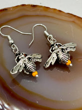 Load image into Gallery viewer, Honey bee shaped metal fish hook earrings with black and yellow glass beads. Measurement: 1" in length