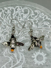 Load image into Gallery viewer, Honey bee shaped metal fish hook earrings with black and yellow glass beads. Measurement: 1" in length