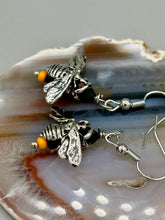 Load image into Gallery viewer, Honey bee shaped metal fish hook earrings with black and yellow glass beads. Measurement: 1" in length