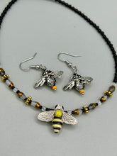 Load image into Gallery viewer, Honey bee shaped metal fish hook earrings with black and yellow glass beads. Measurement: 1" in length