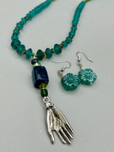 Load image into Gallery viewer, Upgrade your style with these sophisticated blue-green floral pressed glass earrings. Their iridescent glimmer finish adds a glamorous touch for any occasion. Crafted from lightweight glass, each design is both eye-catching and comfortable to wear.  Measurements: 1 1/4" length