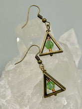 Load image into Gallery viewer, Antique antique brass plated steel ear-wire French Hook Earrings. Antique brass triangle dangle earrings feature a light green round glass beads with tiny small gold tone beads. Unique style earrings display a beautiful complimentary tones between the light green beads and the warm brass tone. Antique antique brass plated steel ear-wire French Hook Earrings. Measurements: 1" length
