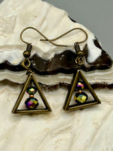 Load image into Gallery viewer, Antique brass triangle dangle earrings feature a purple tone glass bead with an iridescent shimmer finish showcasing hues of gold, purple, blue and pink. Unique style earrings display a beautiful contras between the dark and cool tone glass beads and the warm brass tone. Antique brass plated steel ear-wire French Hook Earrings. Measurements: 1" length