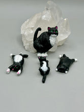 Load image into Gallery viewer, Cat lovers dream, this hand-crafted black tuxedo cat magnet art is the purrfect decoration on refrigerators, lockers, cubicles or toolboxes. The set includes three mini cat figurines, featuring emerald green eyes.