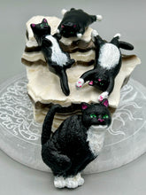 Load image into Gallery viewer, Cat lovers dream, this hand-crafted black tuxedo cat magnet art is the purrfect decoration on refrigerators, lockers, cubicles or toolboxes. The set includes three mini cat figurines, featuring emerald green eyes.