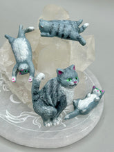 Load image into Gallery viewer, Cat lovers dream, this hand-crafted gray tabby cat magnet art is the purrfect decoration on refrigerators, lockers, cubicles or toolboxes. The set includes three mini cat figurines, featuring emerald green eyes. Measurements: H 2” x W 1/2” x D 3/8” - Cat Magnet H 2” x W 3/8” x D 3/8” - Cat Figurines