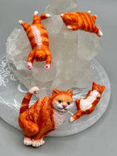 Load image into Gallery viewer, Cat lovers dream, this hand-crafted orange tabby cat magnet art is the purrfect decoration on refrigerators, lockers, cubicles or toolboxes. The set includes three mini cat figurines, featuring emerald green eyes. Measurements: H 2” x W 1/2” x D 3/8” - Cat Magnet H 2” x W 3/8” x D 3/8” - Cat Figurines