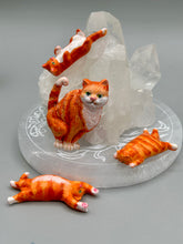 Load image into Gallery viewer, Cat lovers dream, this hand-crafted orange tabby cat magnet art is the purrfect decoration on refrigerators, lockers, cubicles or toolboxes. The set includes three mini cat figurines, featuring emerald green eyes. Measurements: H 2” x W 1/2” x D 3/8” - Cat Magnet H 2” x W 3/8” x D 3/8” - Cat Figurines