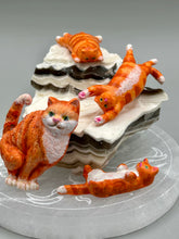 Load image into Gallery viewer, Cat lovers dream, this hand-crafted orange tabby cat magnet art is the purrfect decoration on refrigerators, lockers, cubicles or toolboxes. The set includes three mini cat figurines, featuring emerald green eyes. Measurements: H 2” x W 1/2” x D 3/8” - Cat Magnet H 2” x W 3/8” x D 3/8” - Cat Figurines