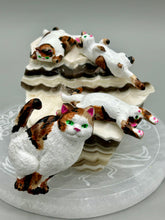 Load image into Gallery viewer, Cat lovers dream, this hand-crafted calico cat magnet art is the purrfect decoration on refrigerators, lockers, cubicles or toolboxes. The set includes one large cat magnet and three mini cat figurines, featuring emerald green eyes. Measurements: H 2” x W 1/2” x D 3/8” - Cat Magnet H 2” x W 3/8” x D 3/8” - Cat Figurines
