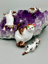 Load image into Gallery viewer, Cat lovers dream, this hand-crafted calico cat magnet art is the purrfect decoration on refrigerators, lockers, cubicles or toolboxes. The set includes one large cat magnet and three mini cat figurines, featuring emerald green eyes. Measurements: H 2” x W 1/2” x D 3/8” - Cat Magnet H 2” x W 3/8” x D 3/8” - Cat Figurines