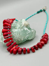 Load image into Gallery viewer, Experience the striking beauty of Southwest Style with this necklace adorned with vibrant blue turquoise and bold red coral beads. Complete the look with matching earrings, perfect for any occasion. Skillfully crafted using metal wire and secured with a hook-eye clasp for a secure and stylish finish.
Measurements: 21" in length
