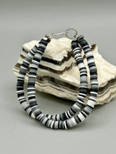 Load image into Gallery viewer, Two strand clay heishi beaded bracelet mixed with black, gray, and white. Crafted with metal wire and fastened with hook-eye clasp.
Measurements: 8 1/4" in length
