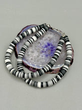 Load image into Gallery viewer, Two strand clay heishi beaded bracelet mixed with black, gray, and white. Crafted with metal wire and fastened with hook-eye clasp.
Measurements: 8 1/4" in length