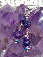 Load image into Gallery viewer, These stunning light and dark purple glass beaded earrings are the perfect accessory for summer ensembles and bohemian-inspired styles, offering a subtle yet stylish touch. Measurements: 1 1/2” in length