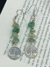 Load image into Gallery viewer, This nature-inspired set of earrings features a single strand of natural green aventurine chip stones and gold glass beads, highlighted by a silver-plated Tree of Life pendant. Measurements: 2 1/4” in length