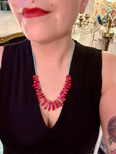 Load image into Gallery viewer, Experience the striking beauty of Southwest Style with this necklace adorned with vibrant blue turquoise and bold red coral beads. Complete the look with matching earrings, perfect for any occasion. Skillfully crafted using metal wire and secured with a hook-eye clasp for a secure and stylish finish.