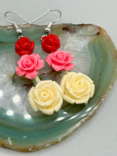 Load image into Gallery viewer, Crafted from quartzite, these highly detailed rose beads come in three striking shades of red, soft pink, and white beaded earrings. This is the ideal accessory for those interested in Dia De Los Muertos as well as those with an appreciation for gardens. Whether dressing up or down, these earrings will lend a distinctive touch to your fashion. Measurements: 1 1/2” in length