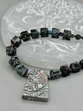 Load image into Gallery viewer, This rustic necklace features an eye-catching large trapezoid-shaped Picasso jasper, hematite, square-shaped snowflake obsidian combo set in a unique and chic design. Handcrafted from genuine stones, this necklace is perfect for any bohemian look. Measurements: Necklace is 21"