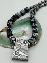 Load image into Gallery viewer, This rustic necklace features an eye-catching large trapezoid-shaped Picasso jasper, hematite, square-shaped snowflake obsidian combo set in a unique and chic design. Handcrafted from genuine stones, this necklace is perfect for any bohemian look. Measurements: Necklace is 21"
