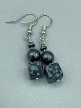 Load image into Gallery viewer, These earrings feature large square shape snowflake obsidian beads complemented with round hematite beads. The neutral cool tones of the stone beads create a unique and versatile style. Measurements: 1 1/4” in length