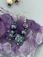 Load image into Gallery viewer, These earrings feature large square shape snowflake obsidian beads complemented with round hematite beads. The neutral cool tones of the stone beads create a unique and versatile style. Measurements: 1 1/4” in length