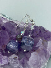 Load image into Gallery viewer, This luxurious set of earrings feature large square-shaped rainbow fluorite beads contrasted against round amethyst beads, presenting an elegant neutral yet cool-toned look. With its unique and versatile style, these earrings make a perfect addition to any wardrobe. Measurements: 1 3/8” in length