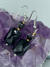 Load image into Gallery viewer, Elegantly crafted from black rectangular and circular glass beads, these dainty earrings offer a versatile style that can effortlessly elevate any ensemble.  Measurements: 1 3/8” in length