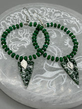Load image into Gallery viewer, Green-White Qinghai Green Jasper Stone Beaded Hoop Earrings provide a nature-inspired look that is perfect for any boho-chic style. These earrings feature natural green jasper stone triangle pendant with small beads of silver and dark apple green magnesite stone for subtle accent. Show off your bohemian look with these eye-catching hoops. Measurements: 3" length