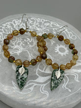 Load image into Gallery viewer, Green-White Qinghai Green Jasper Stone Beaded Hoop Earrings provide a nature-inspired look that is perfect for any boho-chic style. These earrings feature natural green jasper stone triangle pendant with champagne mix melon Czech faceted round glass beads. Glass beads have a tint of light champagne, amber, dark green and gold shimmer for subtle accent. Show off your bohemian look with these eye-catching hoops. Antique Copper Plated Surgical Steel Hammered Long Ear-wire French Hook Earrings.