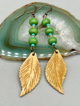Load image into Gallery viewer, Single-stranded earring features bone carved leaf charm earrings with bright green magnesite stone and blue turquoise and gold glass beads. Antique Copper Plated Surgical Steel Hammered Long Ear-wire French Hook Earrings. Measurements: 3” in length
