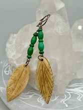 Load image into Gallery viewer, Single-stranded earring features bone carved leaf charm earrings with bright green magnesite stone beads. Antique Copper Plated Surgical Steel Hammered Long Ear-wire French Hook Earrings.  Measurements: 3” in length