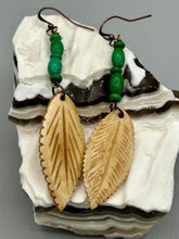 Load image into Gallery viewer, Single-stranded earring features bone carved leaf charm earrings with bright green magnesite stone beads. Antique Copper Plated Surgical Steel Hammered Long Ear-wire French Hook Earrings.  Measurements: 3” in length